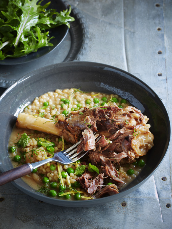 Braised lamb shanks with pearl cous cous and peas