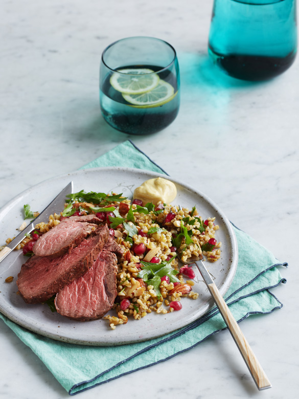Roasted rump with freekah and pomegranate salad