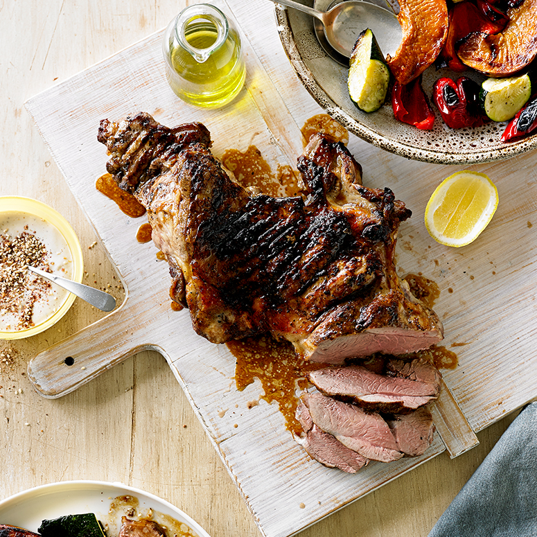 Barbecued butterflied lamb leg with roasted vegetables and tahini dressing recipe | Australian Lamb 