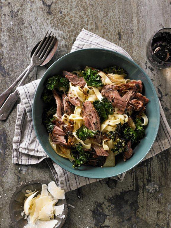 Slow-cooked lamb shoulder with pasta and greens